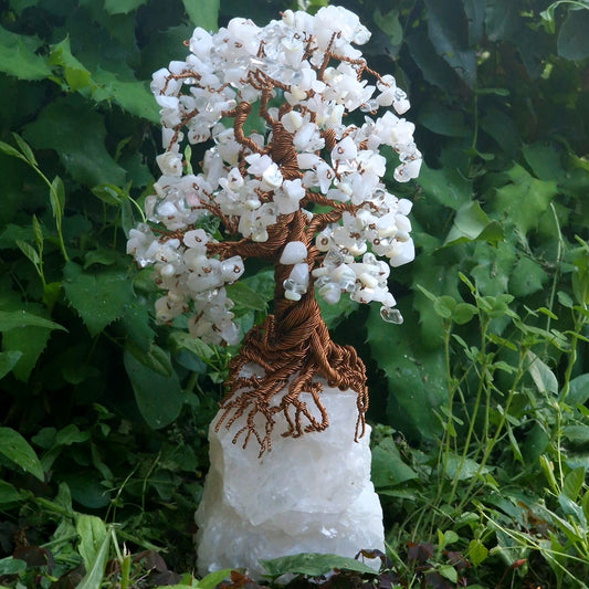 Handcrafted Tree of Life sculpture made with mother of pearl, quartz, and clear crystal on a white quartz base – 26 cm tall.
